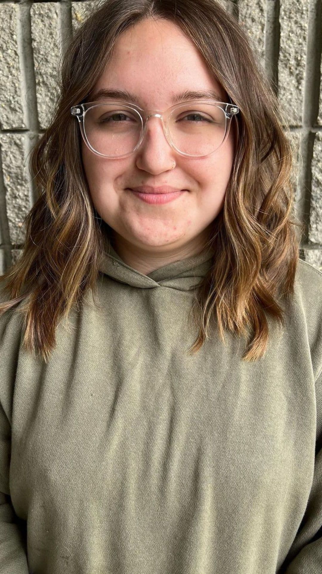 A woman modelling a textured lob hairstyle.