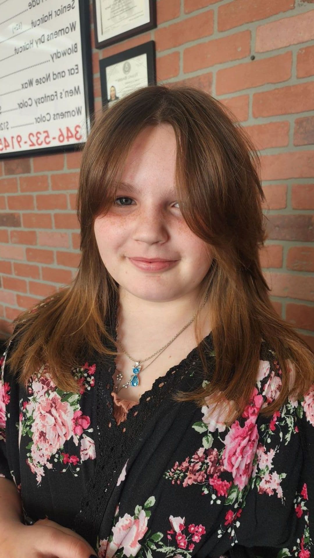 A woman modelling a tousled layers and textured fringe hairstyle.