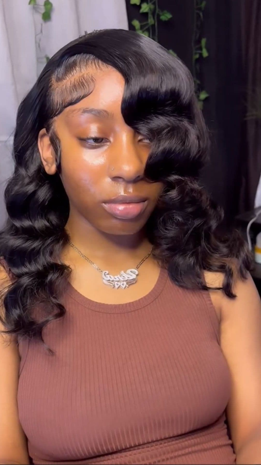 A woman modelling a deep wave hairstyle.