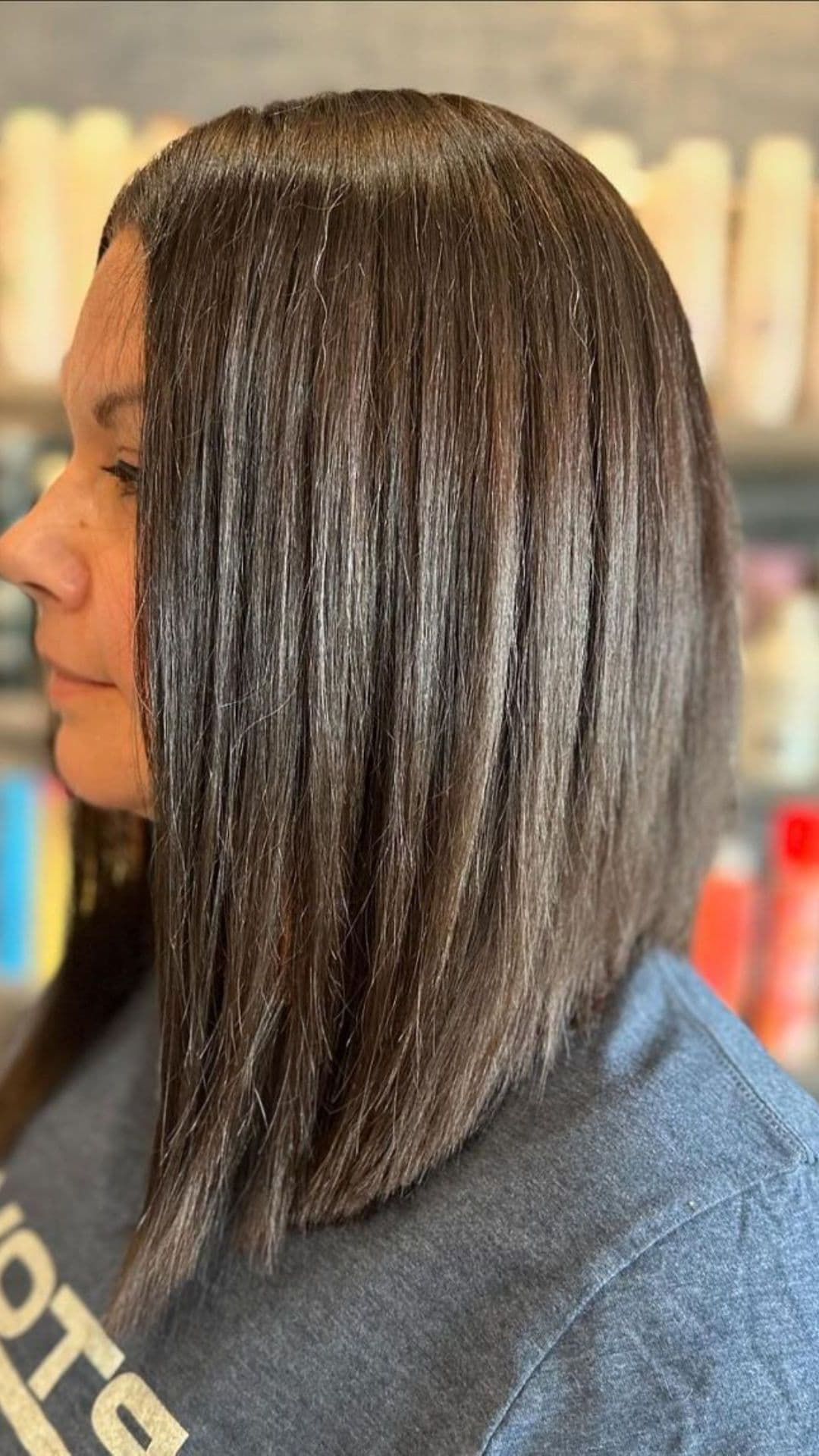 A woman modelling a medium-length angled bob cut.