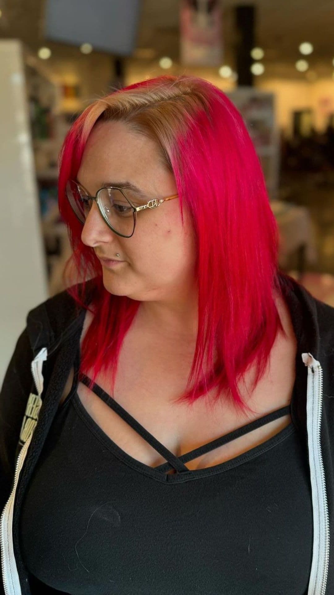 A woman modelling a red blowout hairstyle.