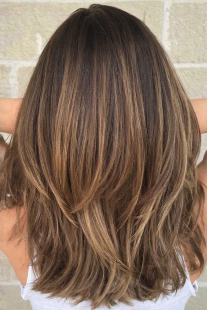 medium layered haircuts for thick hair mid length with bangs
