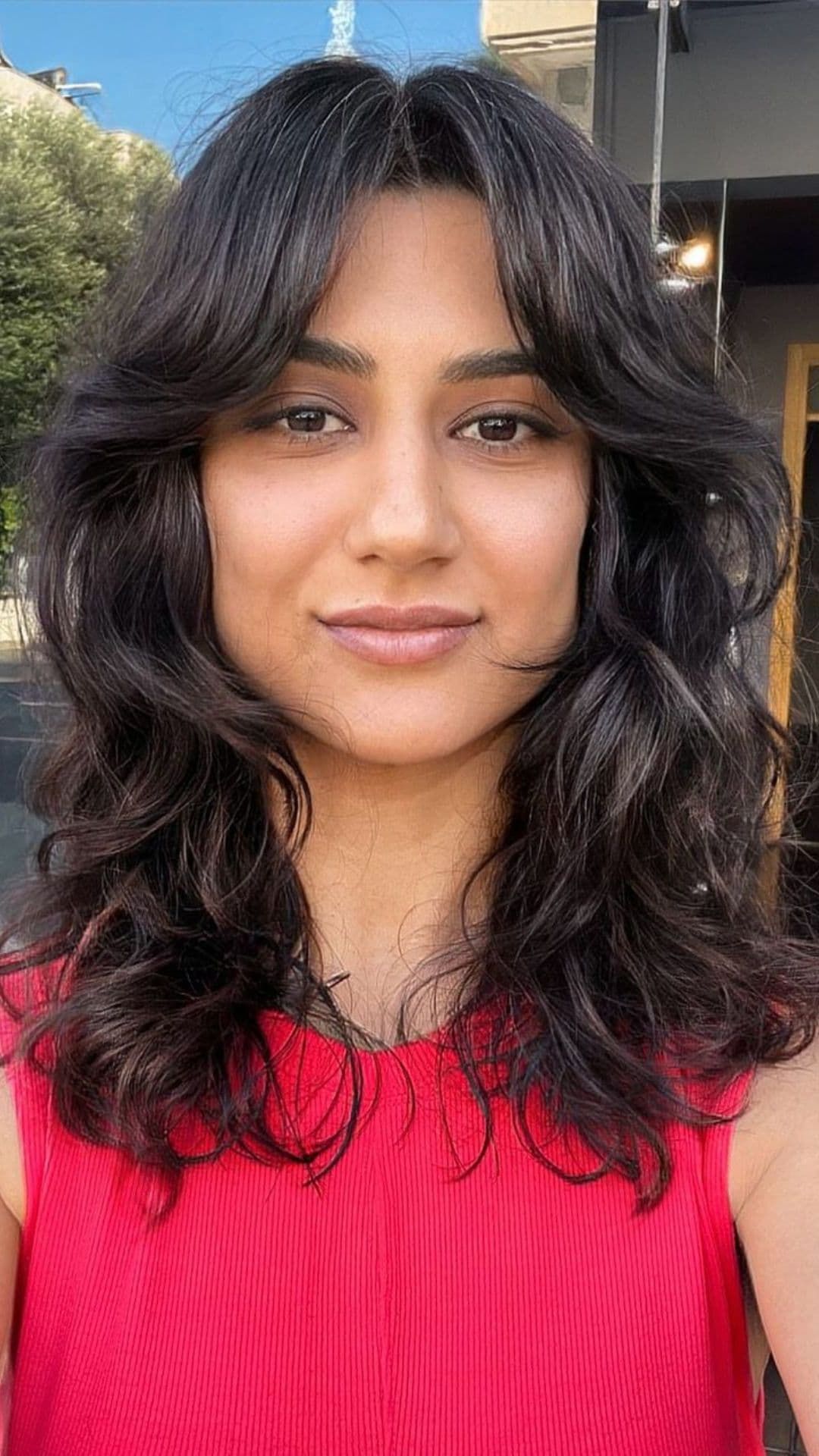 A woman modelling a bottleneck bangs.